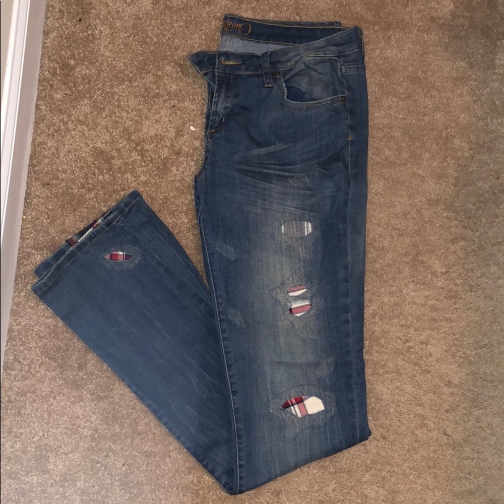 Jeans with red plaid patch design